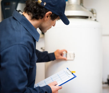 Plumber installing water heater