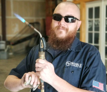 Noble plumber with burner to fix pipes